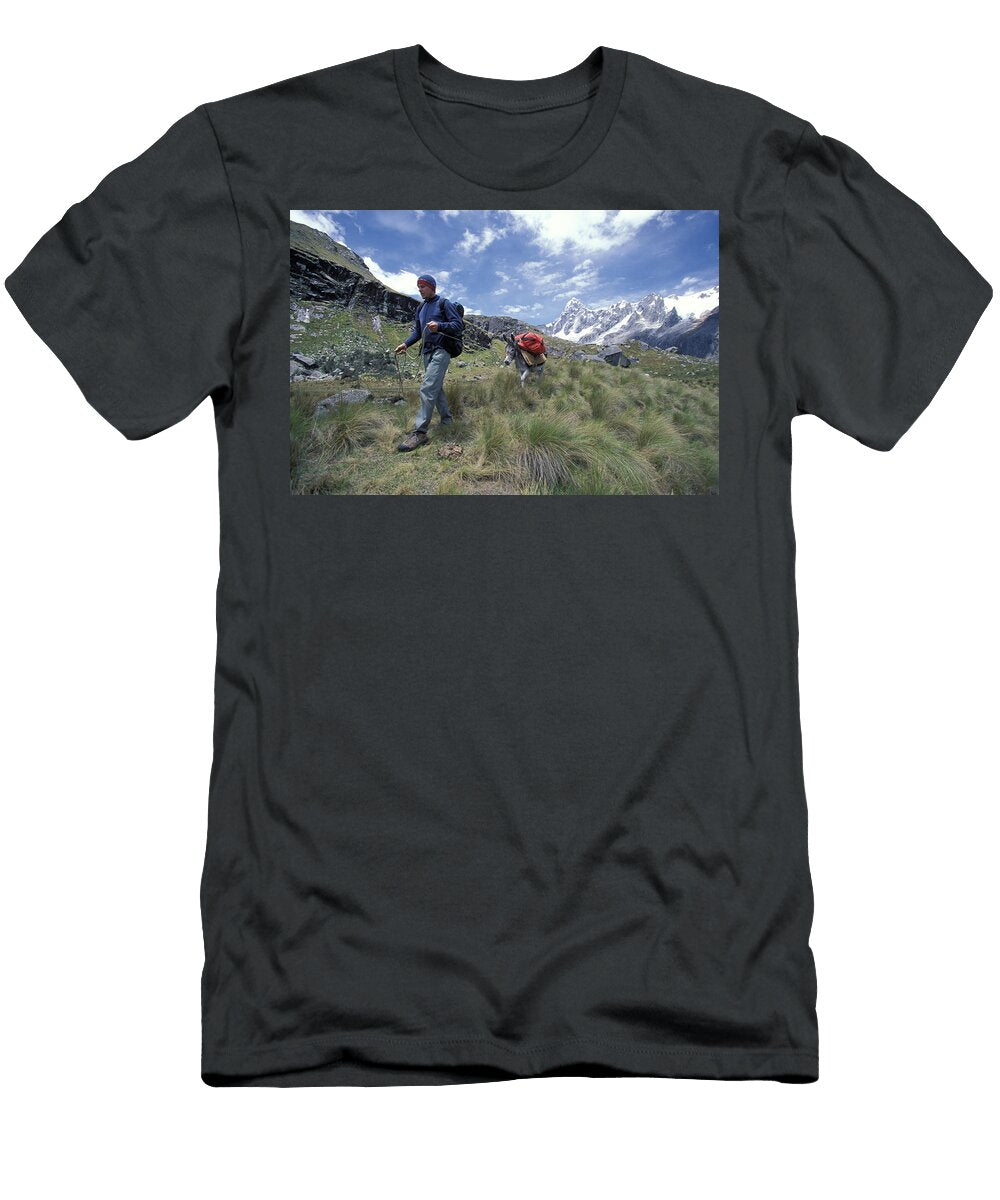 A Man Forcefull Guides His Donkey While Corey Rich T-Shirt