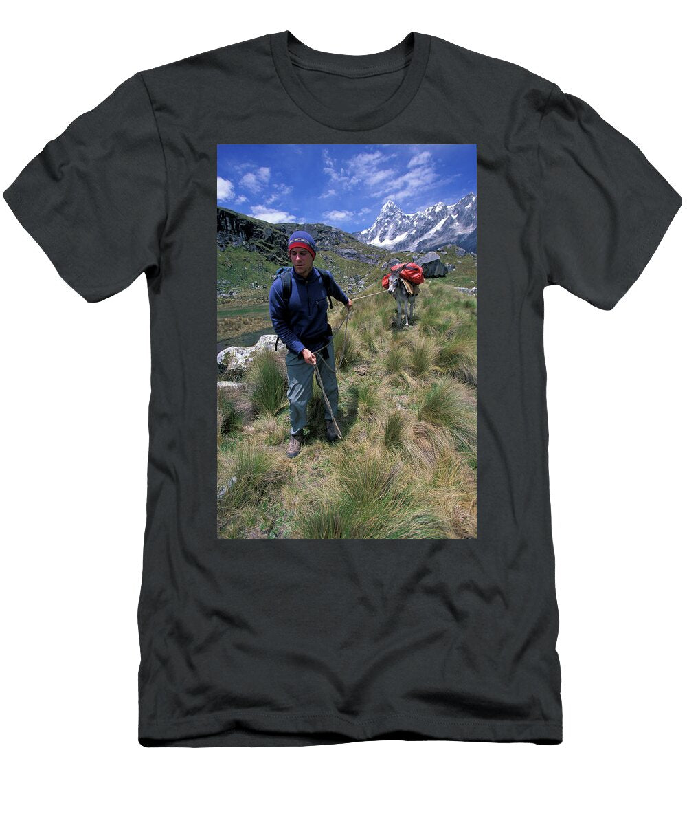 A Man Forcefully Guides His Donkey Corey Rich T-Shirt
