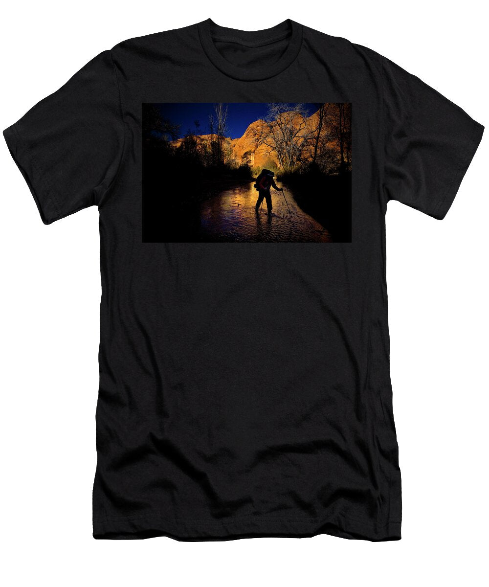 A Man Hikes Through a Stream As the Sun Kirk Mastin T-Shirt
