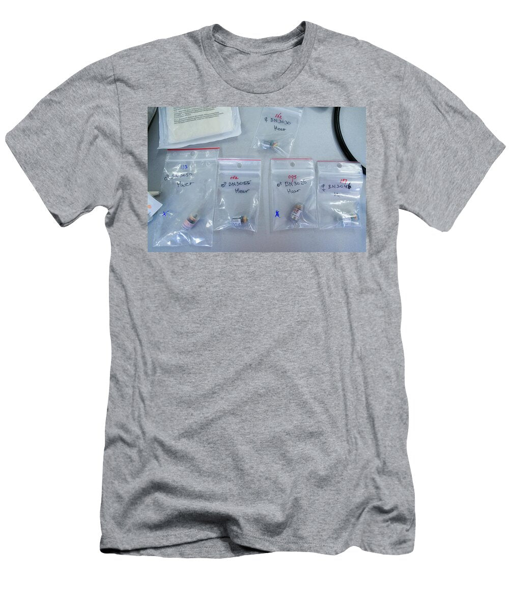 Telemetry Transmitters in Labelled Clear Plastic Bags Which Edwin Giesbers Natureplcom T-Shirt
