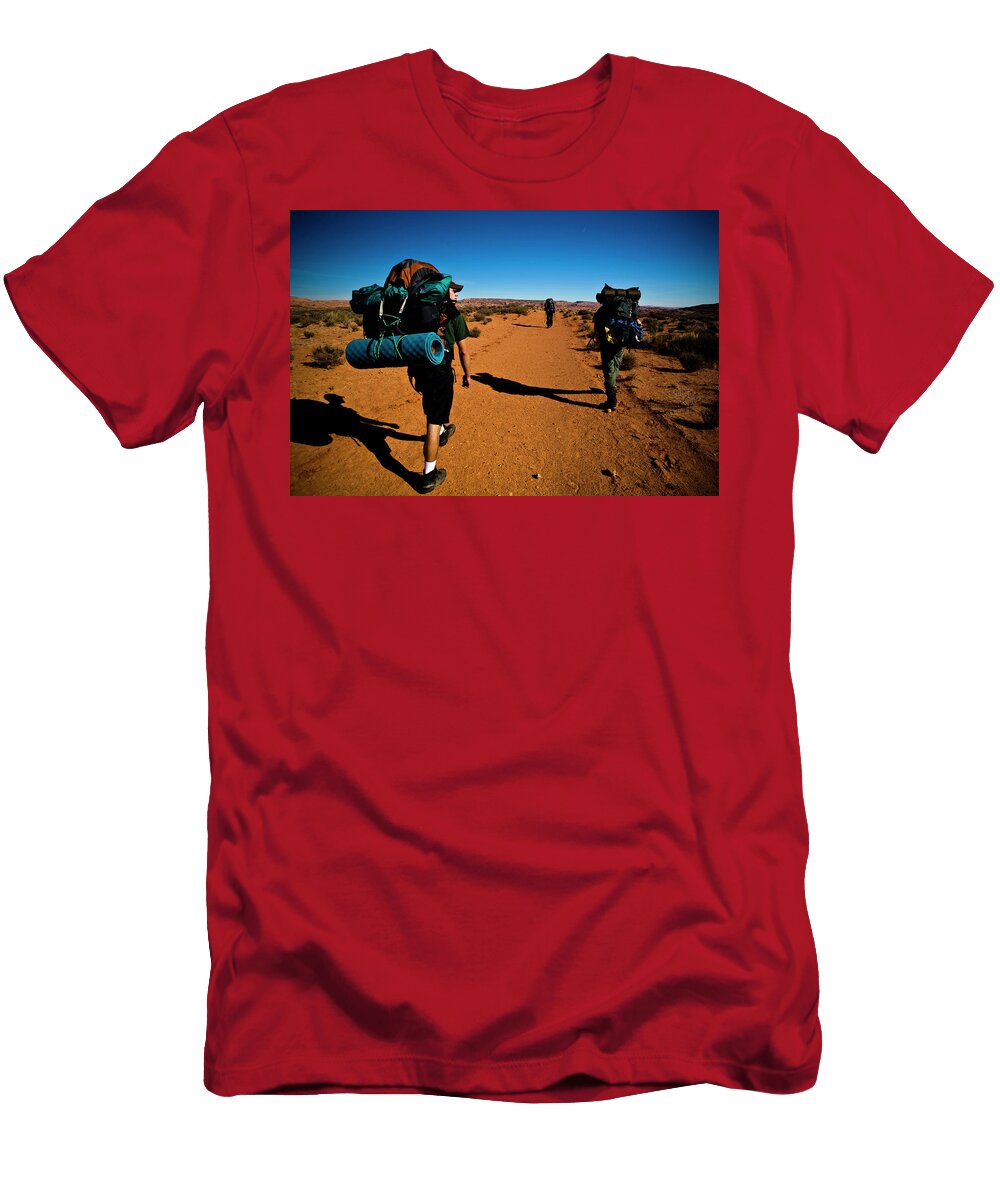 Three People Hike Along a Dirt Trail Kirk Mastin T-Shirt